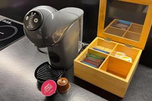 a hair dryer sitting next to a wooden box at Pomer House in Pomerode