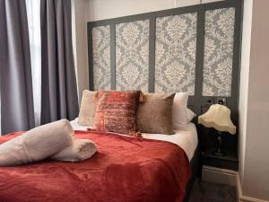 Ένα ή περισσότερα κρεβάτια σε δωμάτιο στο Regency House