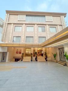 a large building with stairs in front of it at The Fortunaa Avenue in Gwalior