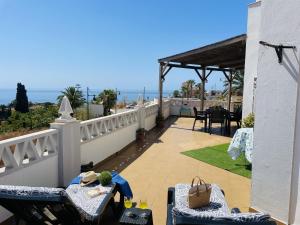 a balcony with a view of the ocean from a house at Casa Blanca con vistas by At Home Costa del in Torrox Costa