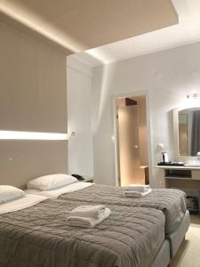 Postel nebo postele na pokoji v ubytování Mantas Hotel + 36 fotografií