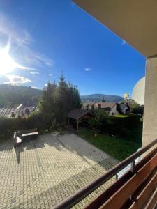 a view of a patio with a bench on a balcony at Dom Wiślańskie Wzgórze in Wisła +38 photos