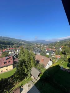 an aerial view of a town with houses and trees at Dom Wiślańskie Wzgórze in Wisła