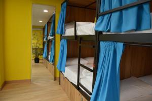 a group of bunk beds in a room at Debod Hostel in Madrid