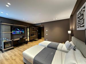 Un televizor și/sau centru de divertisment la Mulaj Hotel