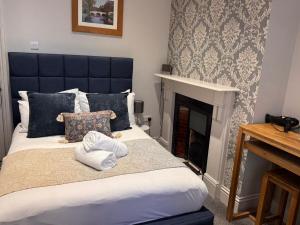 Postel nebo postele na pokoji v ubytování Regency House