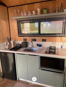 Η κουζίνα ή μικρή κουζίνα στο Via Kairós - Rancho Queimado/SC +85 φωτογραφίες