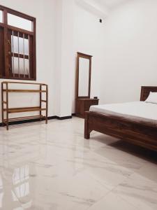 Ένα ή περισσότερα κρεβάτια σε δωμάτιο στο New Villa-Weligama