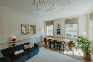 a living room with a couch and a table at The Catnap Suite in Shrewsbury