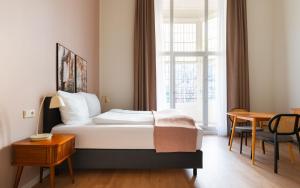 Ένα ή περισσότερα κρεβάτια σε δωμάτιο στο Limehome Kortrijk Gentsestraat