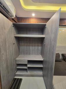 a walk in closet in a room at Cozy Studio in Ghaziabad