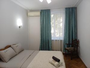 Ένα ή περισσότερα κρεβάτια σε δωμάτιο στο Your apartment in the heart of Chisinau