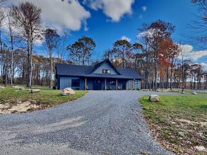 a house with a gravel road in front of it at Mountain Whisper in McHenry