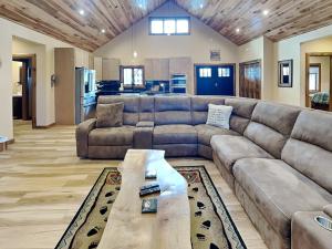 a large living room with a couch and a table at Mountain Whisper in McHenry +32 photos