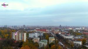 a view of a city with buildings and trees at MMRent Apartament CityLight in Gdańsk