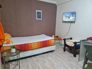 Ένα ή περισσότερα κρεβάτια σε δωμάτιο στο DarCom centre