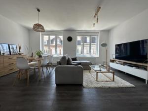 a living room with a couch and a table at Hotel OMAR BM in Casablanca