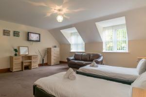 TV a/nebo společenská místnost v ubytování Sycamorwydden