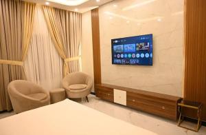 TV a/nebo společenská místnost v ubytování Godown Palace Guest House