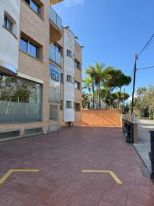 an empty parking lot in front of a building at Hotel 170 in Castelldefels