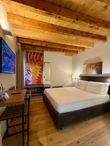 Postel nebo postele na pokoji v ubytování Malvezzi24 Boutique Rooms