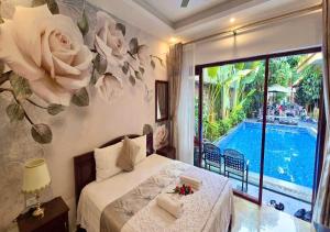 a bedroom with a bed with a view of a pool at Lys Homestay in Ninh Binh