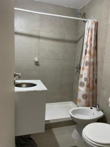 a bathroom with a sink and a toilet and a shower at Hermoso depto en Puerto Santa Fe Portofino in Santa Fe
