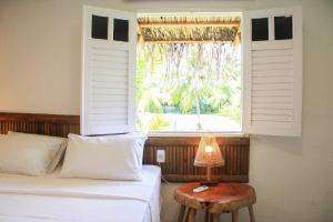 Ένα ή περισσότερα κρεβάτια σε δωμάτιο στο MHV Milagres - Casa Aruã, Luxo, Conforto e Privacidade a 60 metros da Exclusiva Praia do Marceneiro