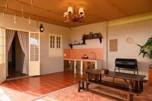 a living room with a wooden table and a table sidx sidx sidx at The Lion Mui Ne in Hòn Lao
