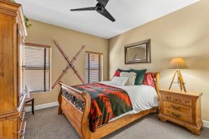 a bedroom with a bed and a dresser and a window at Minutes 2 NAU & downtown & Snowbowl! in Flagstaff