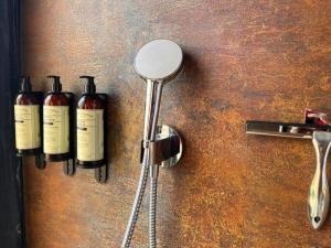 a counter with three bottles of wine on it at Ampe Lodge in Puerto Varas +9 photos