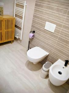 a bathroom with a toilet and a sink at Apartments Ana in Maribor +42 photos