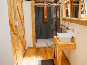 a bathroom with a sink and a shower at AfriCamps at Mackers in Hazyview +20 photos