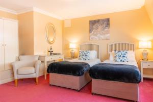 Postel nebo postele na pokoji v ubytování The Moorings Hotel & Seafood Restaurant