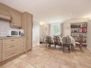 a kitchen and dining room with a table and chairs at 4 Bed in Keswick oc-sz434 in Applethwaite +14 photos
