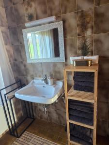 a bathroom with a sink and a mirror and towels at Ferienhaus DaPfusterer in Bad Mitterndorf +83 photos