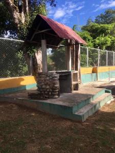 a small building with a roof on top at Cabaña brisa melgar in Melgar