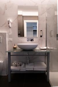 a bathroom with a sink and a mirror at Park Hotel Cellini in Lido di Jesolo