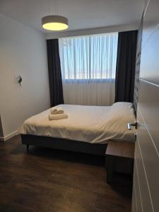 Postel nebo postele na pokoji v ubytování 1 Bedroom Grand Sapphire + 12 fotografií