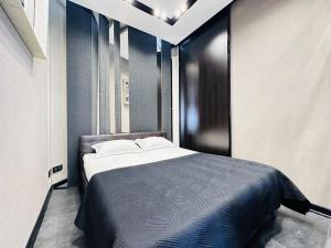 Ένα ή περισσότερα κρεβάτια σε δωμάτιο στο EXPO Boulevard-3