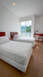 Postel nebo postele na pokoji v ubytování Hotel Boutique Casa Concordia