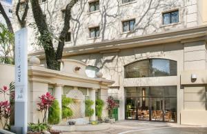 een weergave van de voorkant van een gebouw bij Meliá Campinas in Campinas