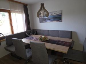 a dining room table and chairs with a plate on it at Ferienhaus DaPfusterer in Bad Mitterndorf +115 photos