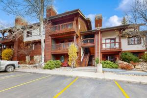 a large building with a parking lot in front of it at Pines at Orehouse 301 PH2 in Steamboat Springs