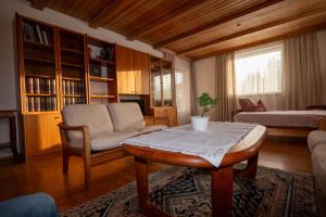 a living room with a couch and a table at Ferienhaus Kaiser Lothar in Reutte