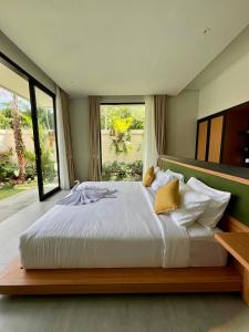 Postel nebo postele na pokoji v ubytování Guru Darma Villa