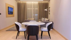 a dining room with a table and chairs at Crowne Plaza Dushanbe by IHG in Dushanbe
