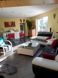 a living room with a couch and a table at Ti harmoniel in Guingamp