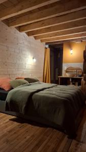 Postel nebo postele na pokoji v ubytování Le Grenier du Moulin