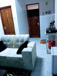 a living room with a couch and a table at Talla Homes in Mombasa
